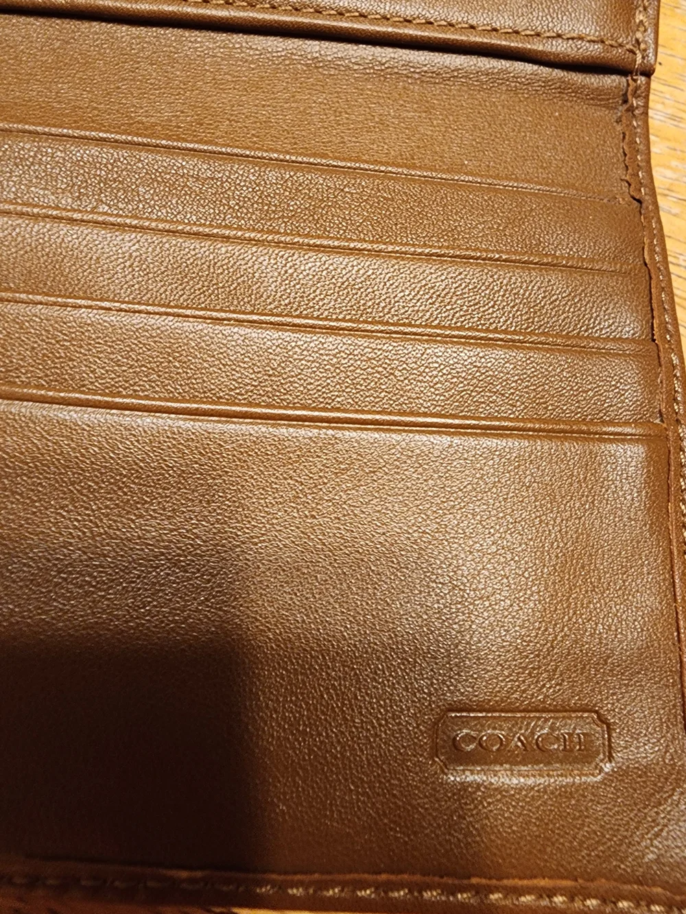 vintage Coach Soho Buckle Wallet crafted in brown leather prominent front Buckle